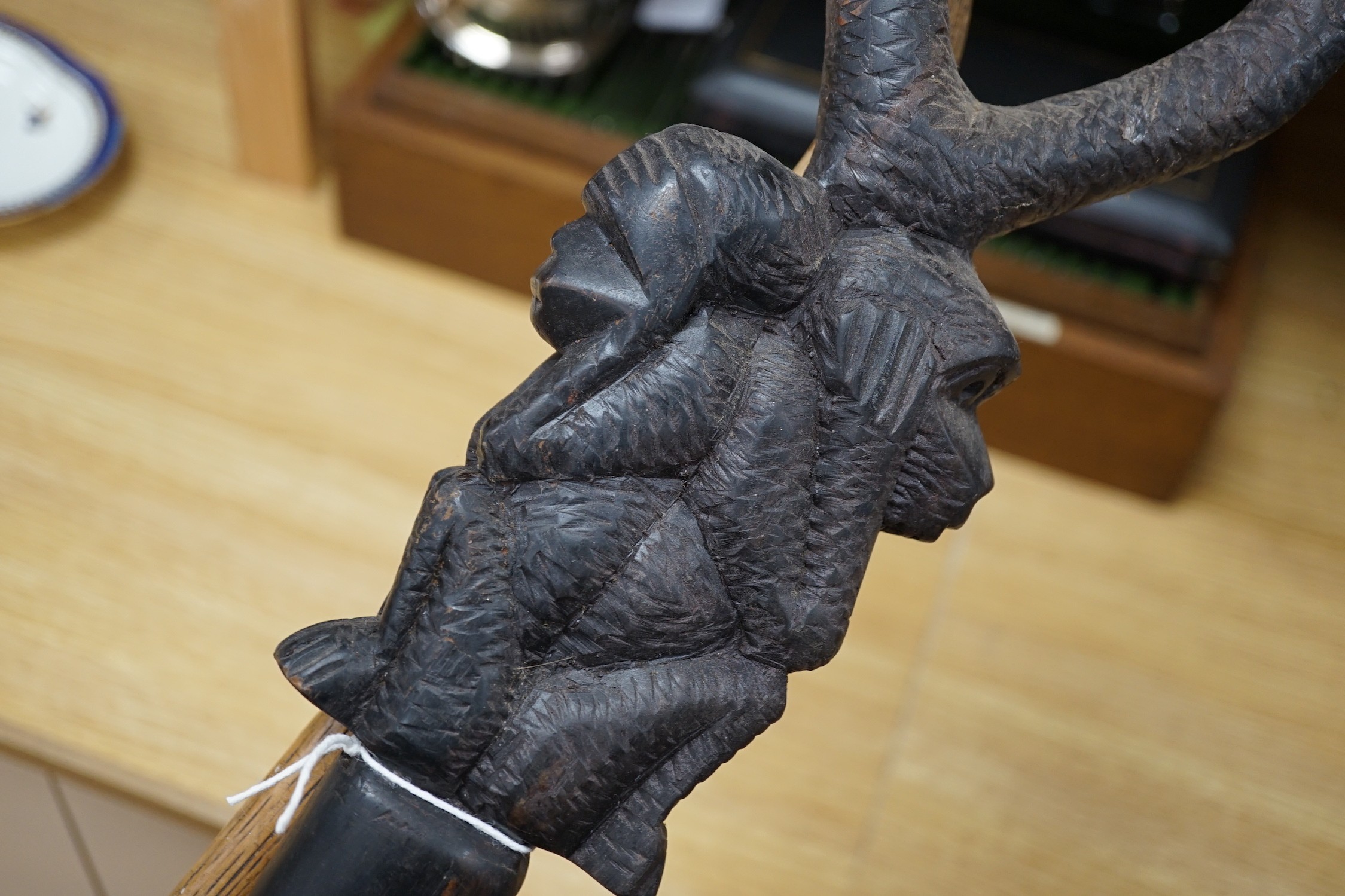 An African carved wood walking cane and a ‘dogs head’ walking cane